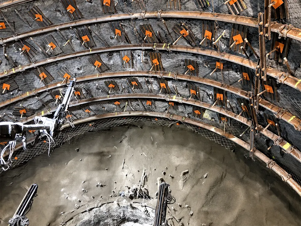 Self-drilling anchor installation in a NATM tunnel